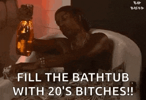a person is taking a bath in a bathtub while holding a bottle of money .