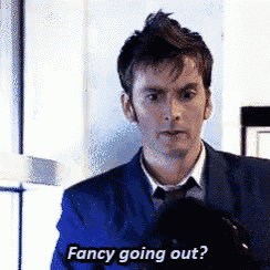 a man in a suit and tie is asking if fancy going out .