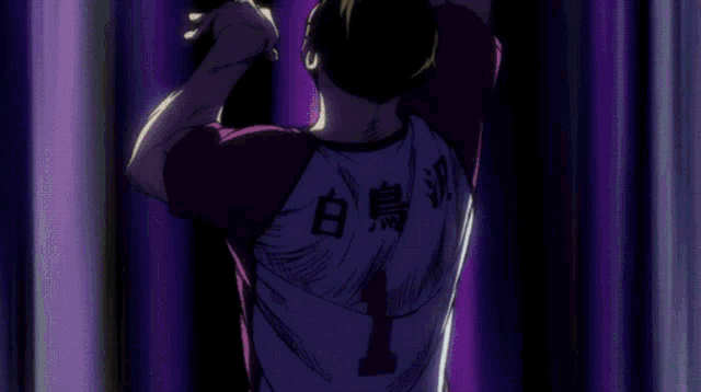 a group of volleyball players are playing a game and one of them has the number 33 on his shirt
