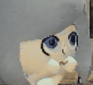 a close up of a cartoon character with blue eyes .