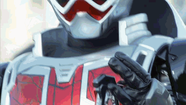 a close up of a person wearing a red and white costume