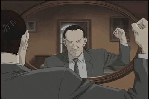 a man in a suit and tie has a serious look on his face