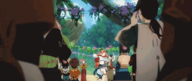 a group of people are standing in front of a tree with purple flowers hanging from it