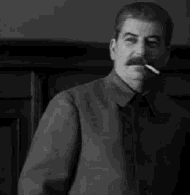a man with a mustache is smoking a cigarette in a black and white photo with a caption in russian