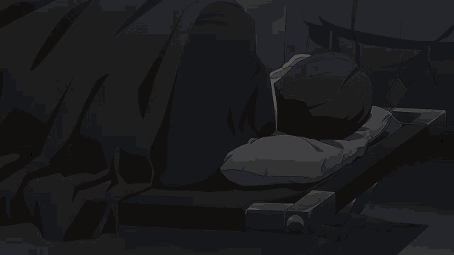 a person laying on a bed with a hood on their head
