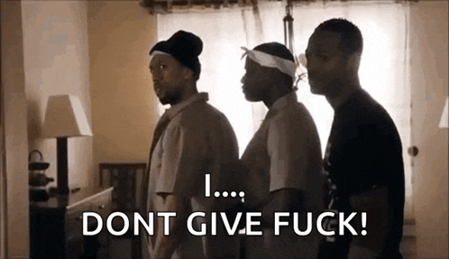 three men are standing next to each other in a living room and one of them is saying `` dont give fuck ! ''