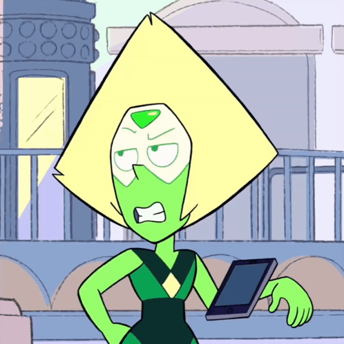 peridot from steven universe is holding a tablet and making an angry face