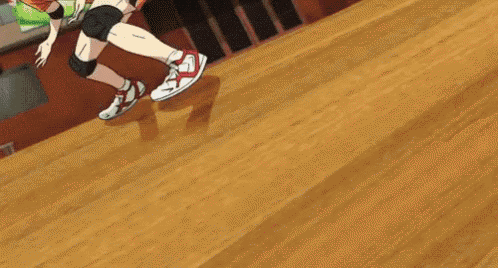 a person is jumping on a wooden floor in a cartoon .