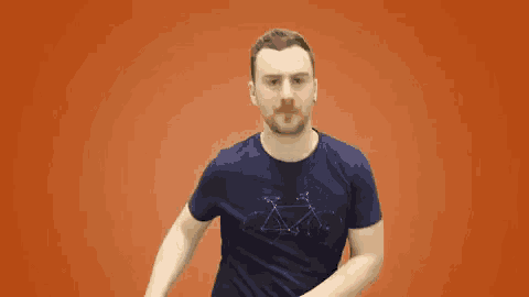 a man wearing a blue shirt with a mercedes logo on it