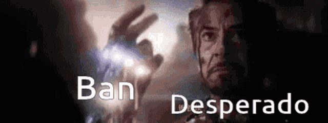 a man in a dark room with the words " ban desperado " on the bottom