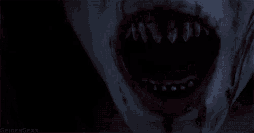 a close up of a person 's mouth with blood on it .