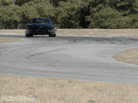 a car is driving down a road with motorweek written on the bottom left