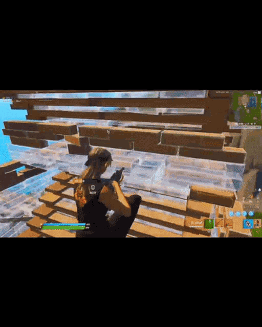 a person holding a gun in a video game with the letters r on their back