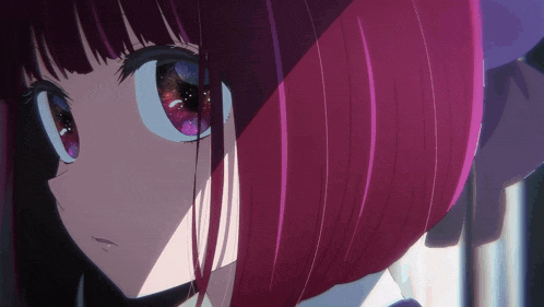 a close up of a person 's face with purple hair