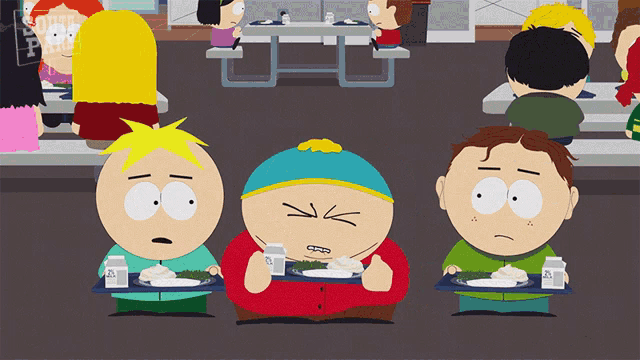 three south park characters are eating at a table