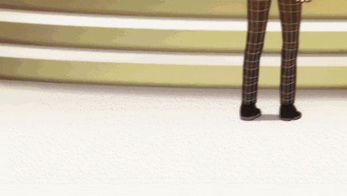 a person wearing plaid pants is standing on a white floor