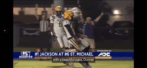 a football player with the number 1 on his jersey is being congratulated by another player