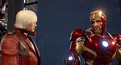 a man in a red suit is standing next to another man in a red suit in a video game .
