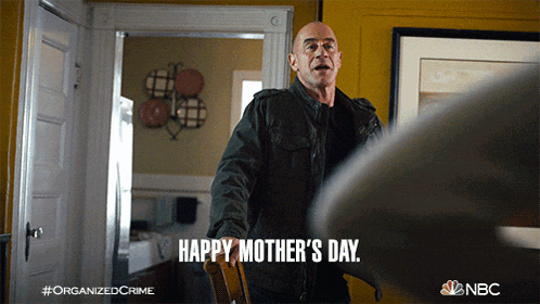 a man says happy mother 's day while standing in a chair