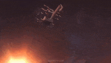 a helicopter is flying through the air and shooting a laser beam .