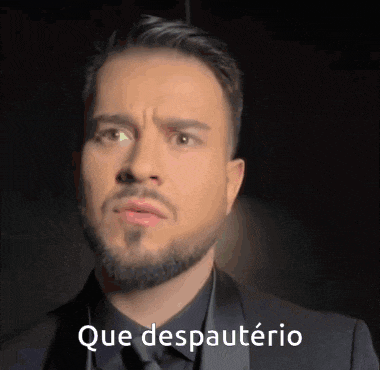 a man with a beard is wearing a black suit and says que despauterio on the bottom of his face