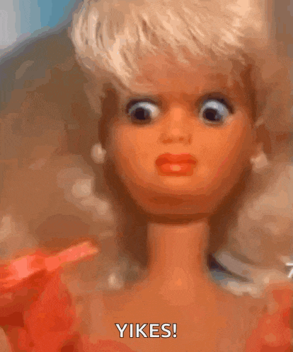 a close up of a barbie doll making a funny face and saying yikes