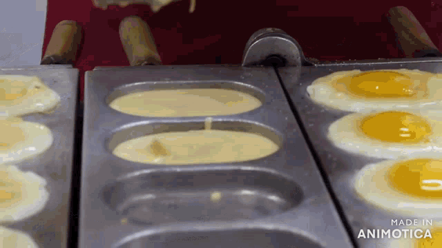 eggs are being cooked in a pan with the words made in animotica visible