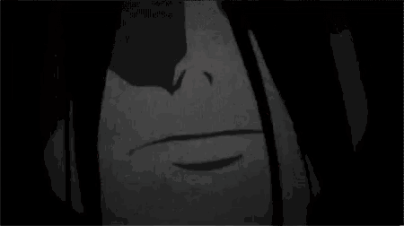 a black and white photo of a person 's face with a smile on it .