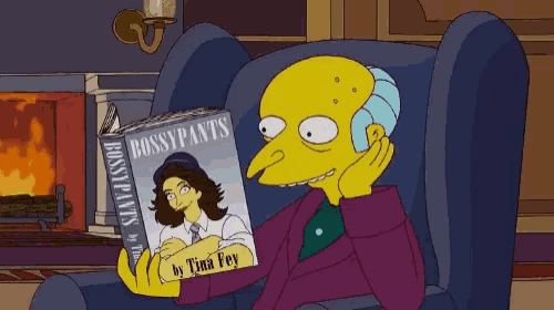 a cartoon character sitting in a chair reading a book titled bossypants