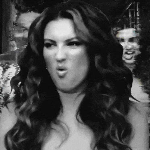 a woman with long hair making a funny face