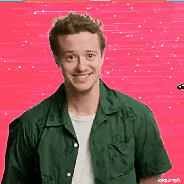 a man in a green shirt is smiling in front of a pink background with joequinngifs written below him
