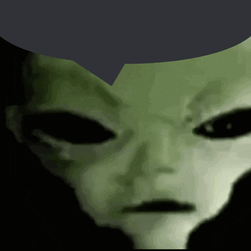 a close up of an alien 's face with a gray background