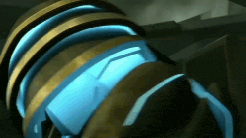 a close up of a blue and gold object with a glowing light coming out of it .