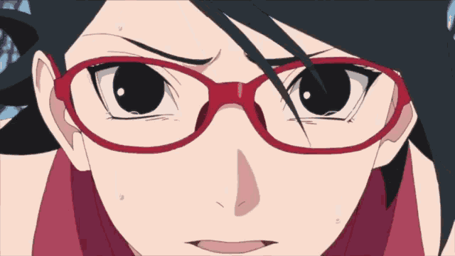 a close up of a person wearing red glasses