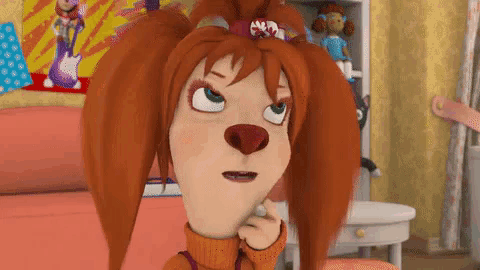 a cartoon character with red hair is sitting on a bed .