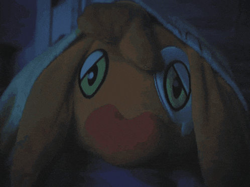 a stuffed animal with big eyes and a circle around it