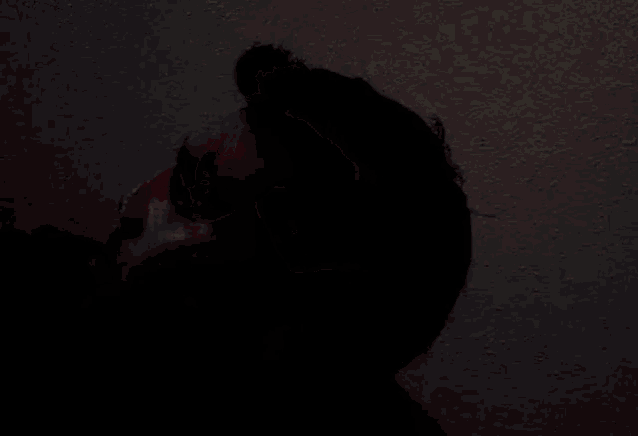 a close up of a person 's face with red paint on it .