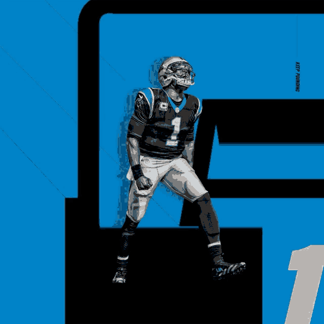 a man in a carolina panthers uniform stands in front of a blue background
