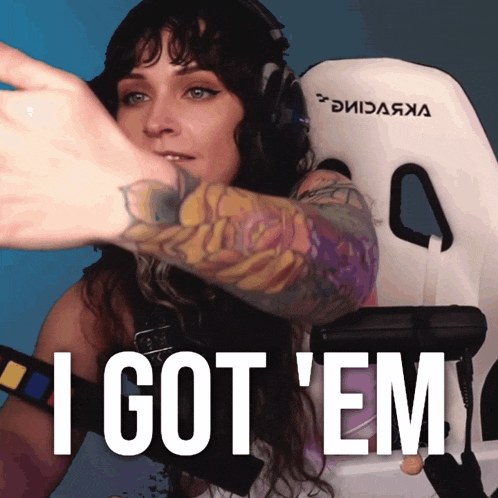a woman sitting in a chair with the words i got ' em written on the bottom