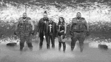 a group of people standing next to each other in a black and white photo