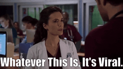 a woman in a lab coat says " whatever this is it 's viral " to a man