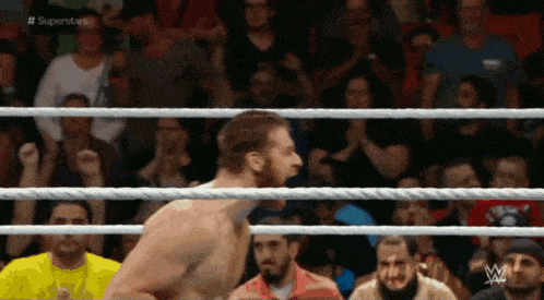 a man in a wrestling ring with the word superstars on the top