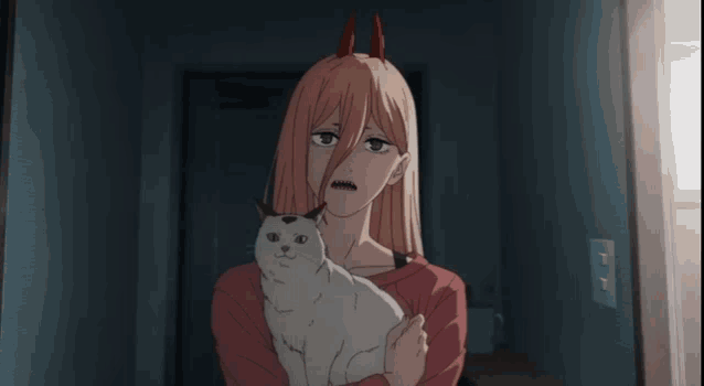 a girl with horns is holding a white cat in her arms