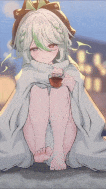 a girl wrapped in a white blanket is holding a cup of tea