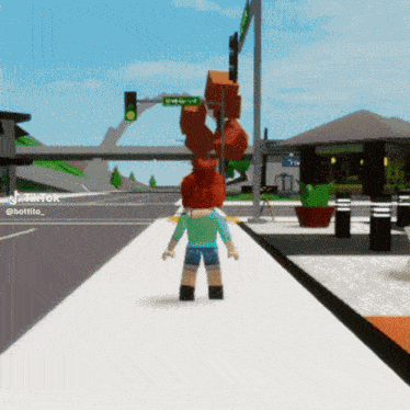 a person walking down a street with a sign that says emerald street on it