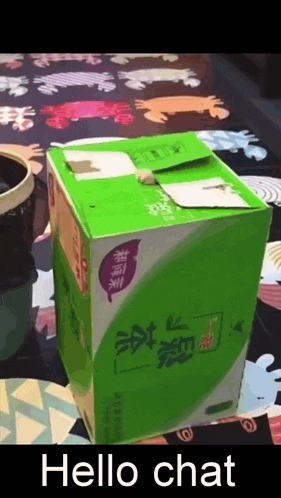 a green box that says hello chat is on a table