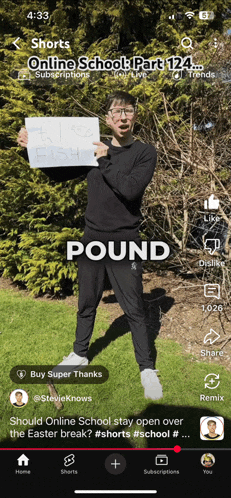 a man is holding up a sign that says pound