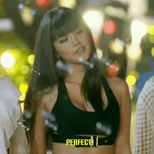 a woman in a black crop top is surrounded by bubbles and the word perfect is on the bottom