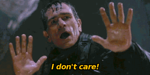 a man with his hands up and the words " i don 't care " below him