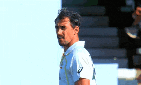 a man wearing a white shirt with the number 10 on the front